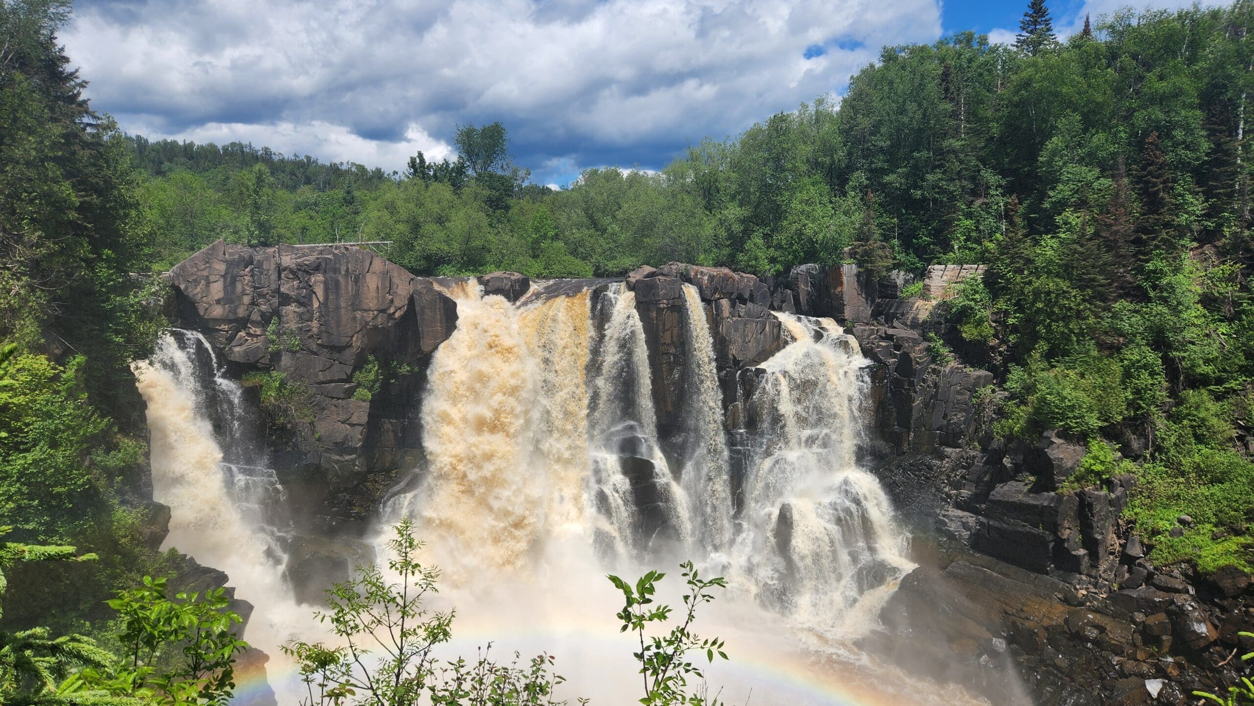 Grand Portage State Park – Best State Parks in Minnesota - Dohrn Travels A vibrant rainbow arcs over High Falls at Grand Portage State Park, one of the best state parks in Minnesota.