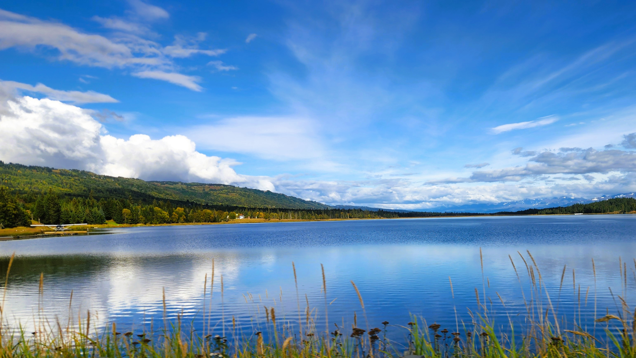 Beluga Lake Homer Alaska Scenic View - Dohrn Travels Scenic view of Beluga Lake in Homer, Alaska with clear skies and mountain reflections