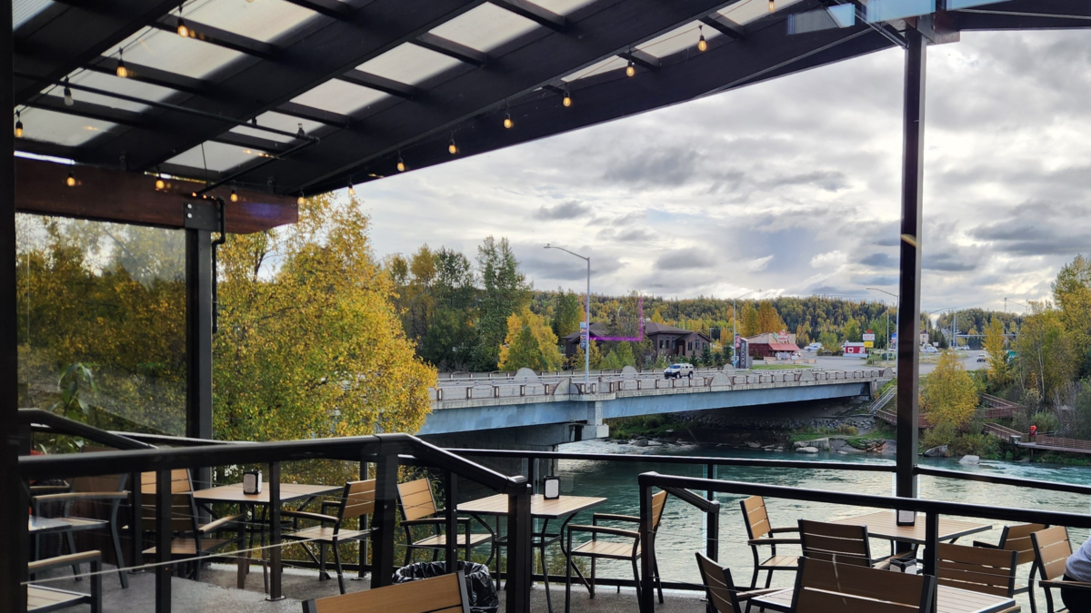Bridge Lounge Patio Overlooking the Kenai River – Kenai, Alaska - Dohrn Travels Patio seating at Bridge Lounge overlooking the Kenai River in Kenai, Alaska.