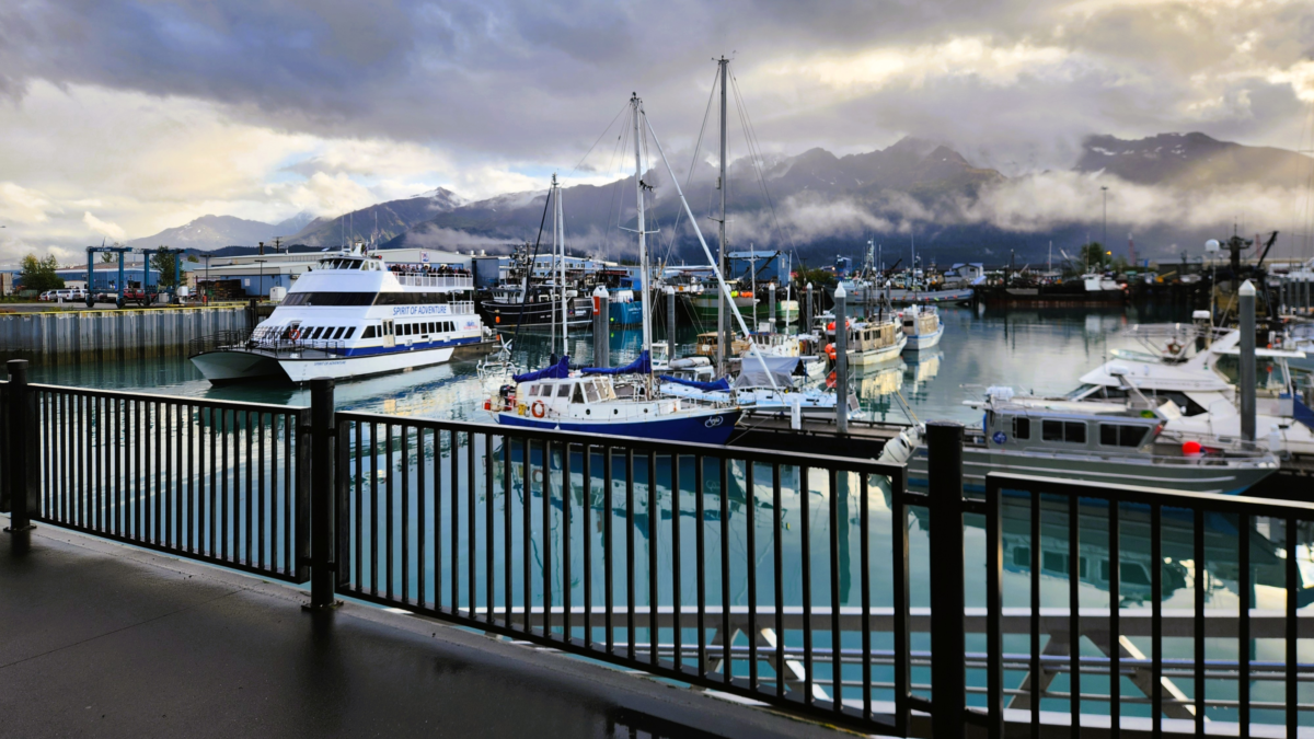Major Marine Tours boat docked at Seward Boat Harbor with mountain views in Alaska