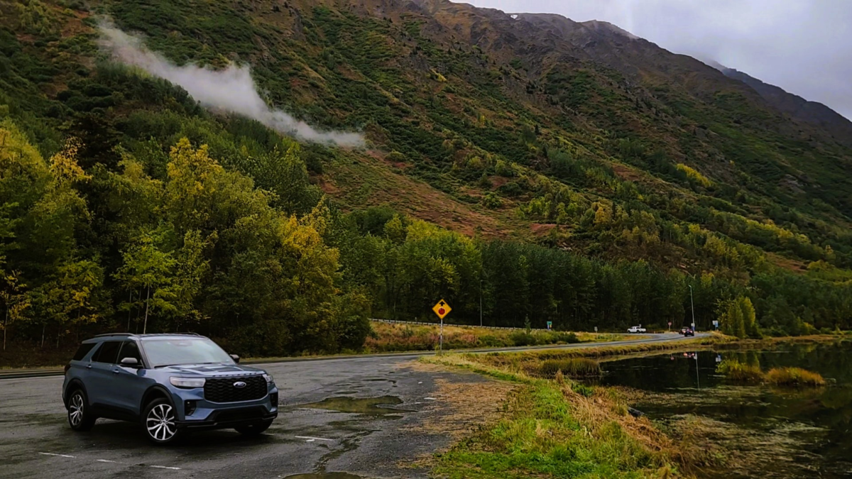 Tern Lake Alaska – Scenic Stop with Rental Car - Dohrn Travels Rental car parked near Tern Lake, Alaska surrounded by fall colors and mountain views along the scenic Seward Highway.