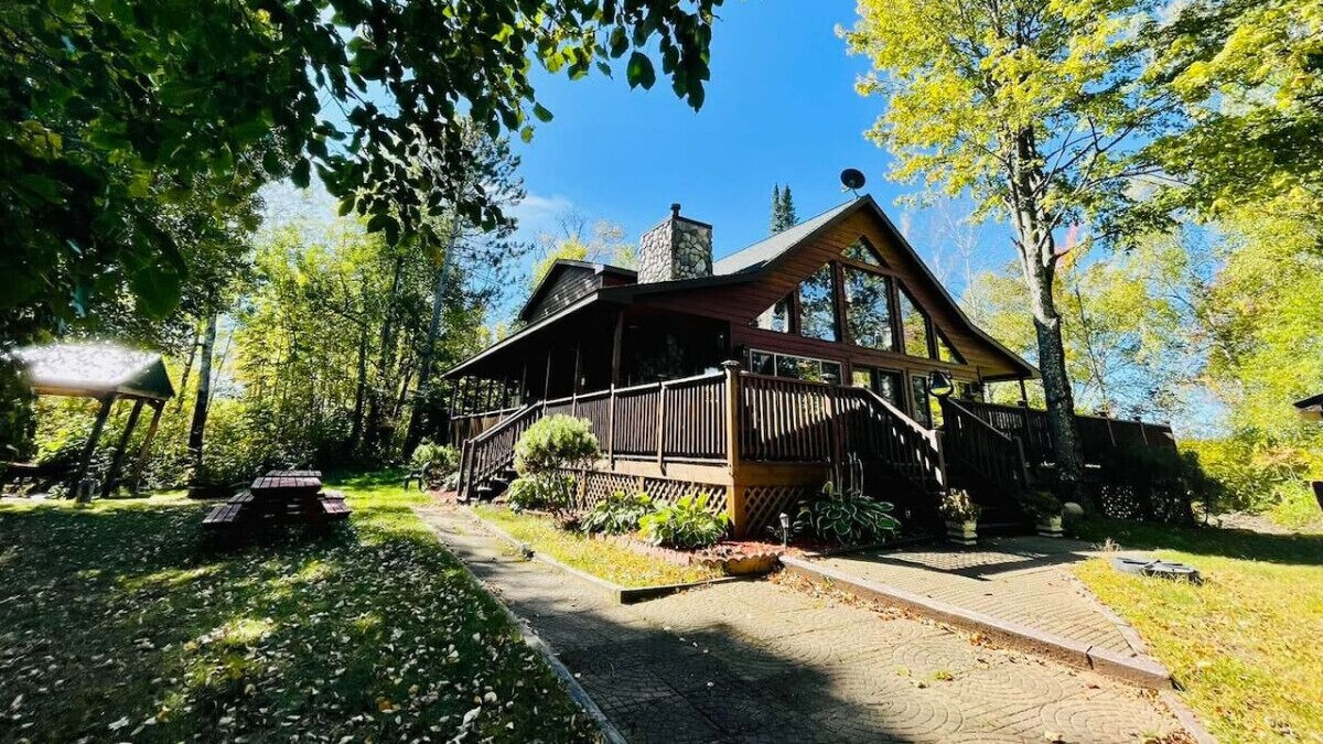 Lakeside cabin on a private island on Lake Winter surrounded by trees in Northern Wisconsin