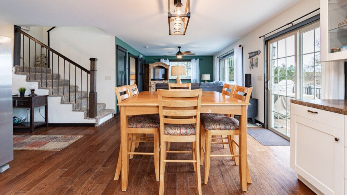 Dining area and open living space inside The Lakeside cabin near Lake Winter in Northern Wisconsin