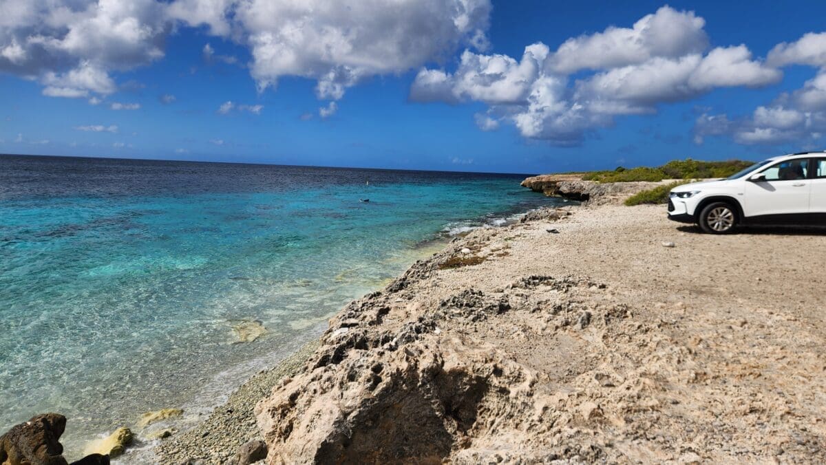 Tolo Dive Site Bonaire Shore Entry - Dohrn Travels Rocky shoreline and clear water at Tolo Dive Site in Bonaire