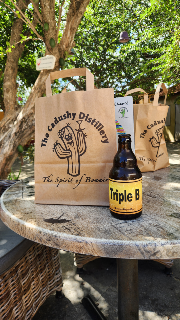 Souvenirs at The Cadushy Distillery - Dohrn Travels Cadushy Distillery gift bags and cactus-infused beer in Bonaire