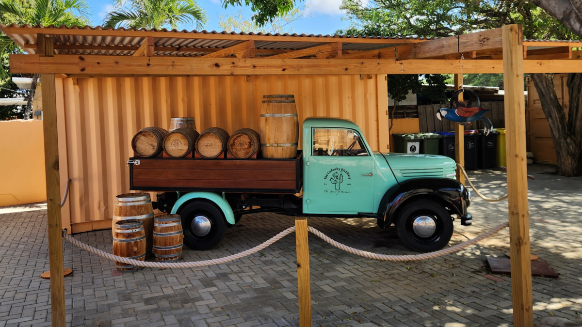 Vintage Truck at The Cadushy Distillery Bonaire - Dohrn Travels Vintage delivery truck display with barrels at The Cadushy Distillery in Rincon, Bonaire