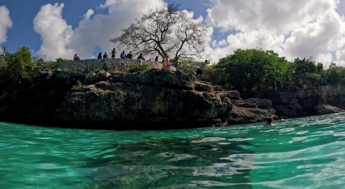 Cliff Jumping at Grote Knip Beach - Dohrn Travels Cliff jumping area at Grote Knip Beach Curaçao viewed from the water