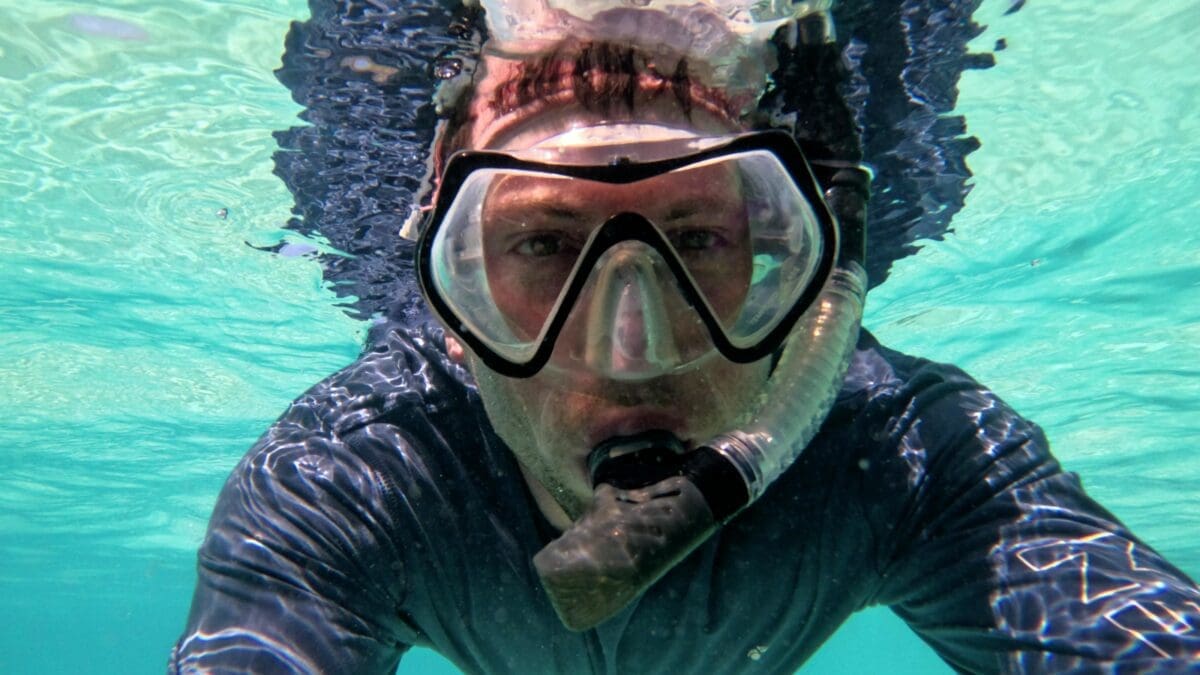 Snorkeling at Grote Knip Beach Curaçao - Dohrn Travels Snorkeling at Grote Knip Beach in Curaçao with clear turquoise water and rocky reef